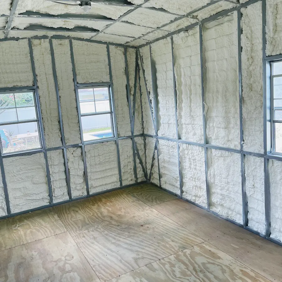 Closed-cell spray foam insulation applied to wall cavities in a residential project in Anamosa